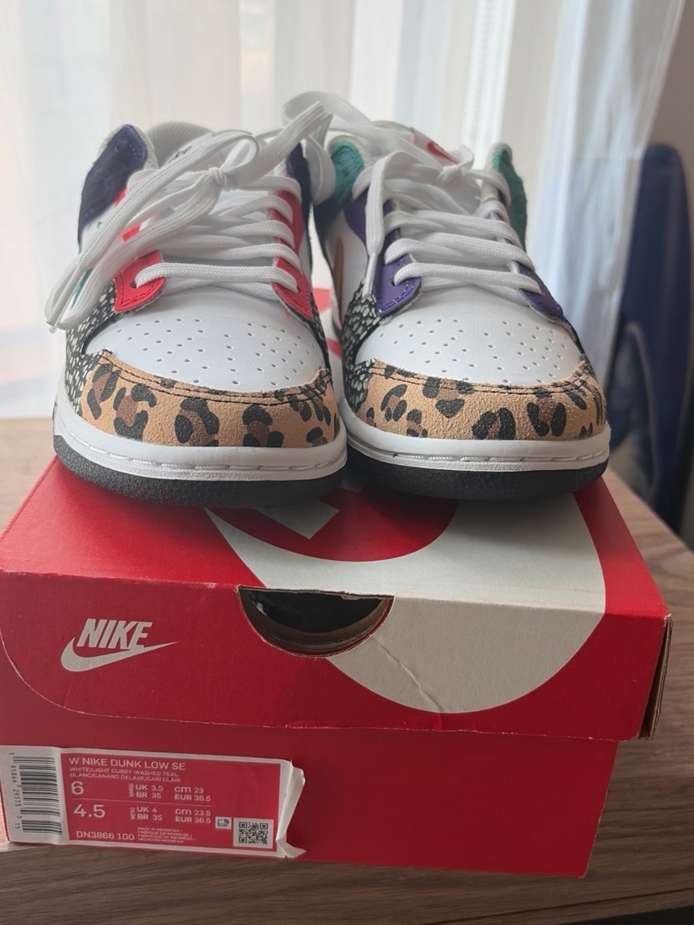 Nike Women's White Low-Top Sneakers with Leopard Toe and Multicolor Accents